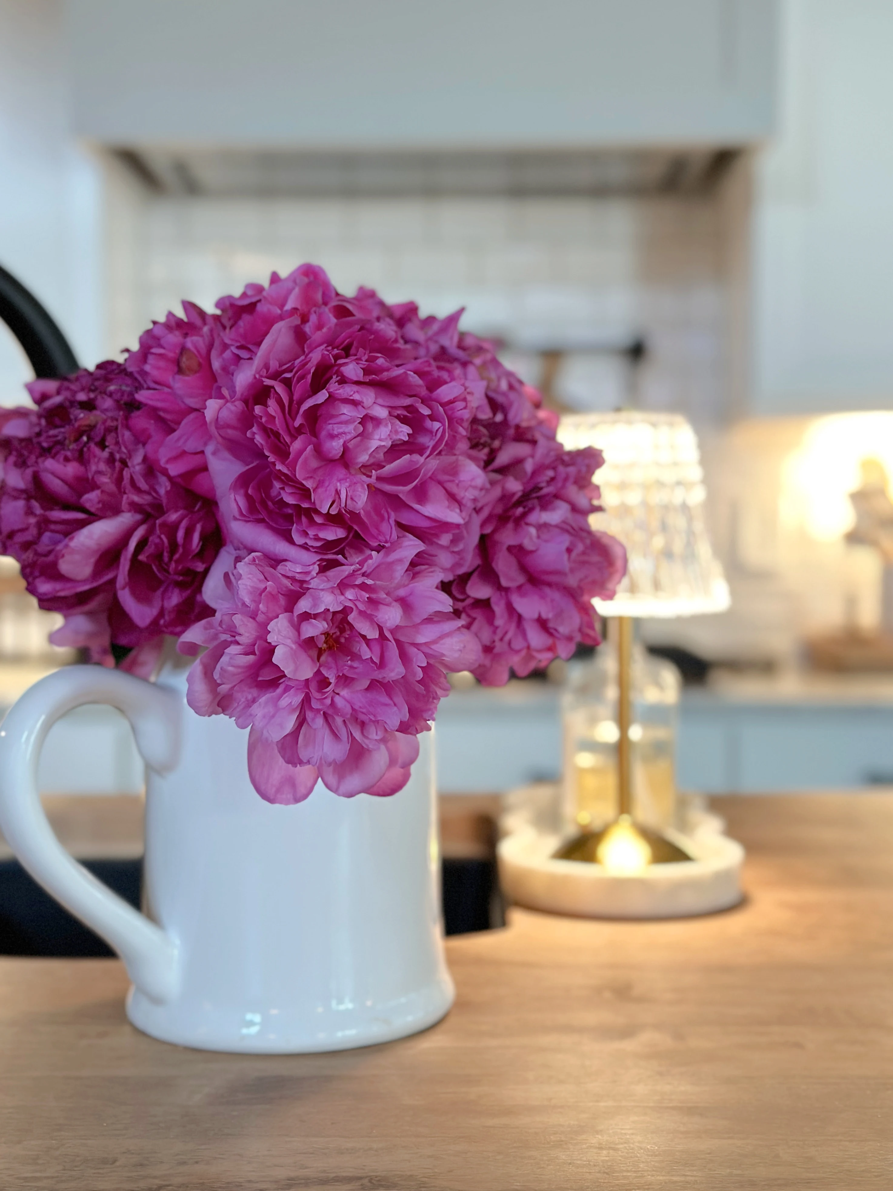pink peonies white pitcher